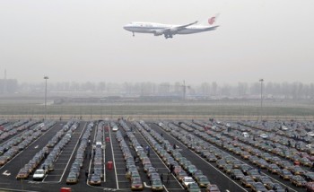 An Air China jetliner descends at Beijing airport